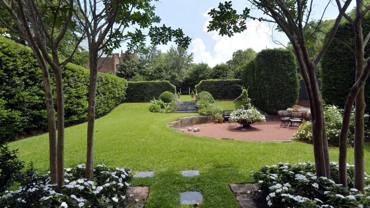 The backyard garden at the Magnolia Street home of Macon’s Carey Pickard and Chris Howard has been the site of weddings, fundraisers and other gatherings.