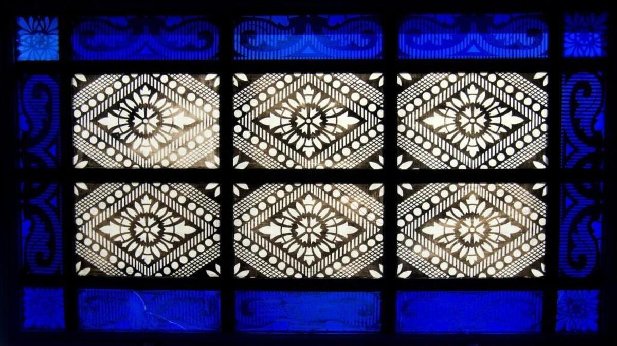 This in an example of a decorative pattern applied to glass in a window.