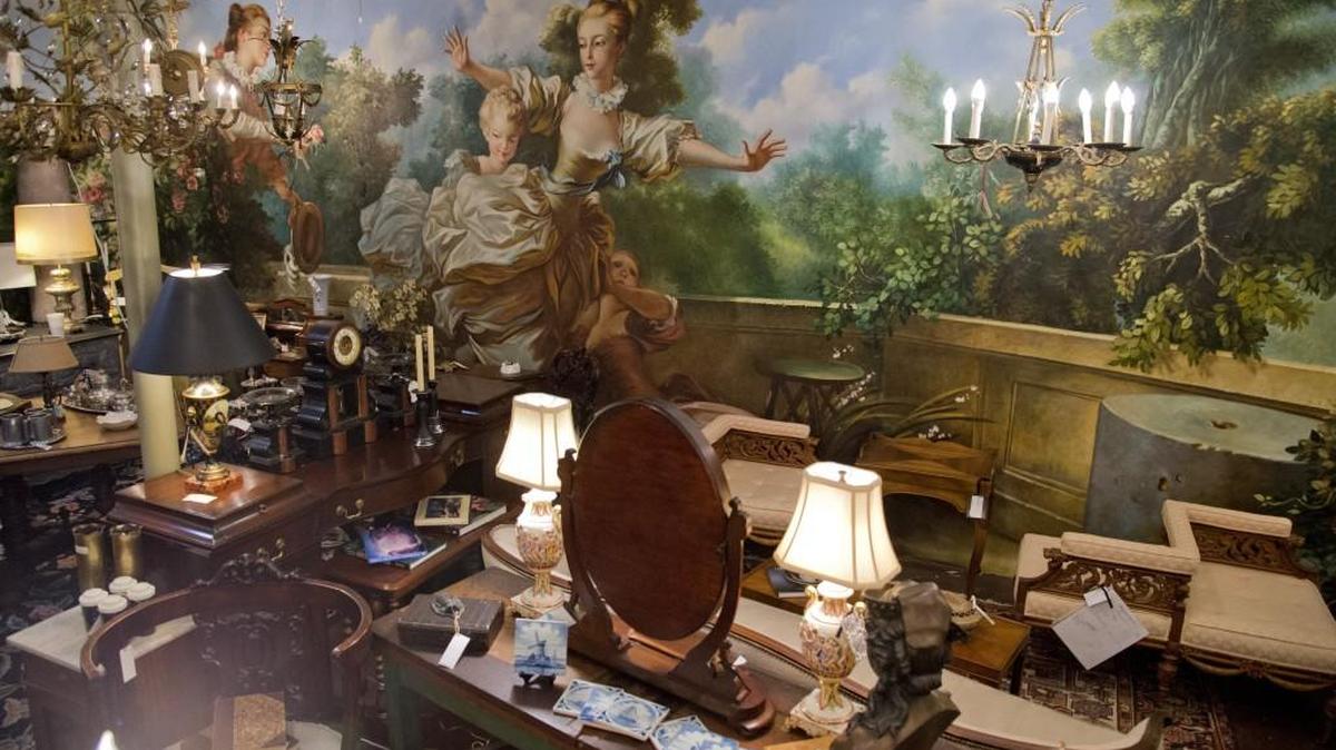 A canvas mural that once hung in the Magnolia Room in the downtown Rich’s Department Store is now at the Antique Center on Ingleside Avenue.