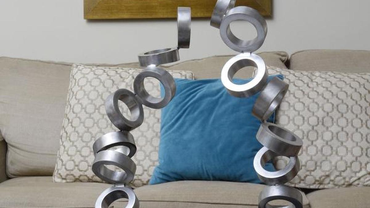 This metal sculpture by Jim Bodell is displayed in his home.
