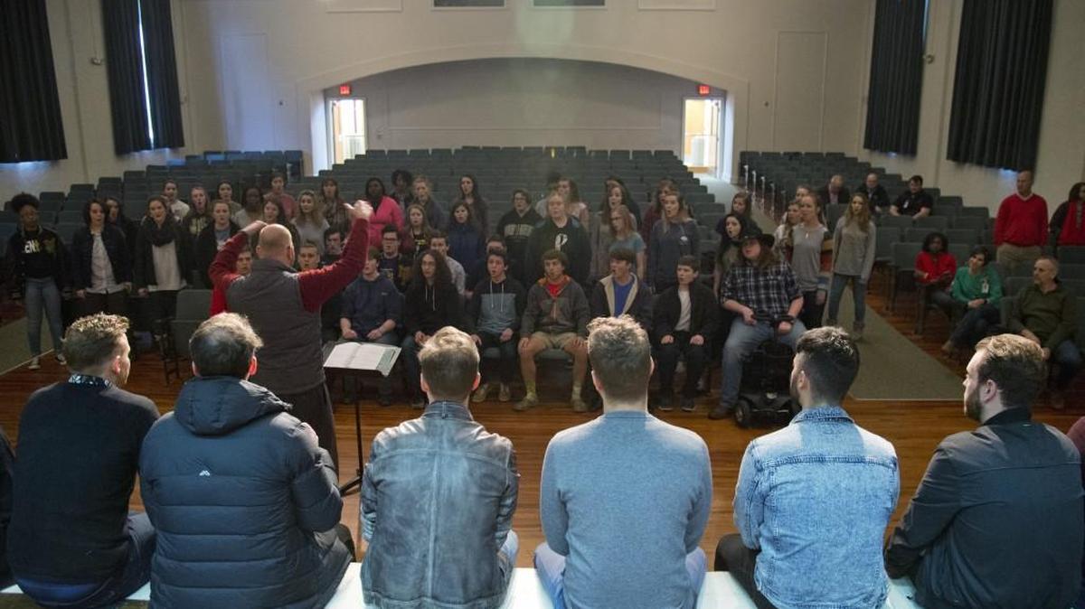 Mary Persons High School choral director Charles Hernandez leads the chorus as the perform for the The Ten Tenors during a Master Class in the Monroe County Board of Education Auditorium on Dec. 15. The Ten Tenors later performed at the Monroe County Fine Arts Center.