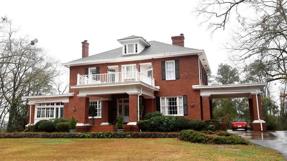 The front elevation of Bradley House, perched on a knoll above Forsyth Road, has a commanding view of its surroundings.