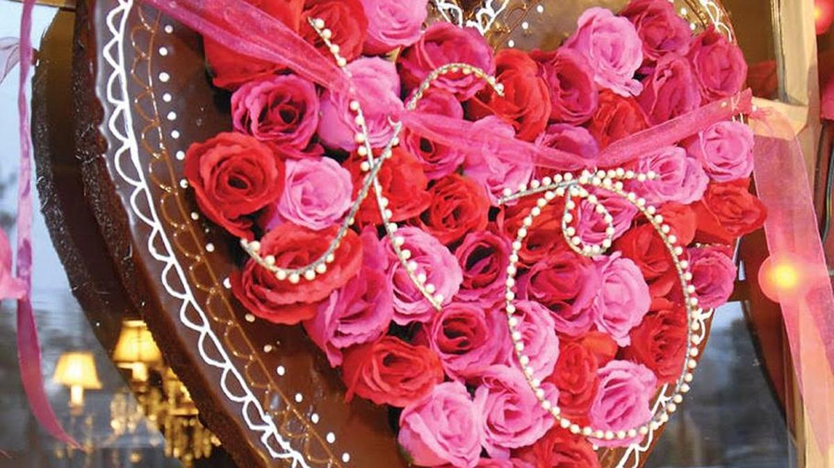 Mark Ballard’s Valentine’s Day wreath involves all three of the Valentine’s Day staples — hearts, roses and chocolate.