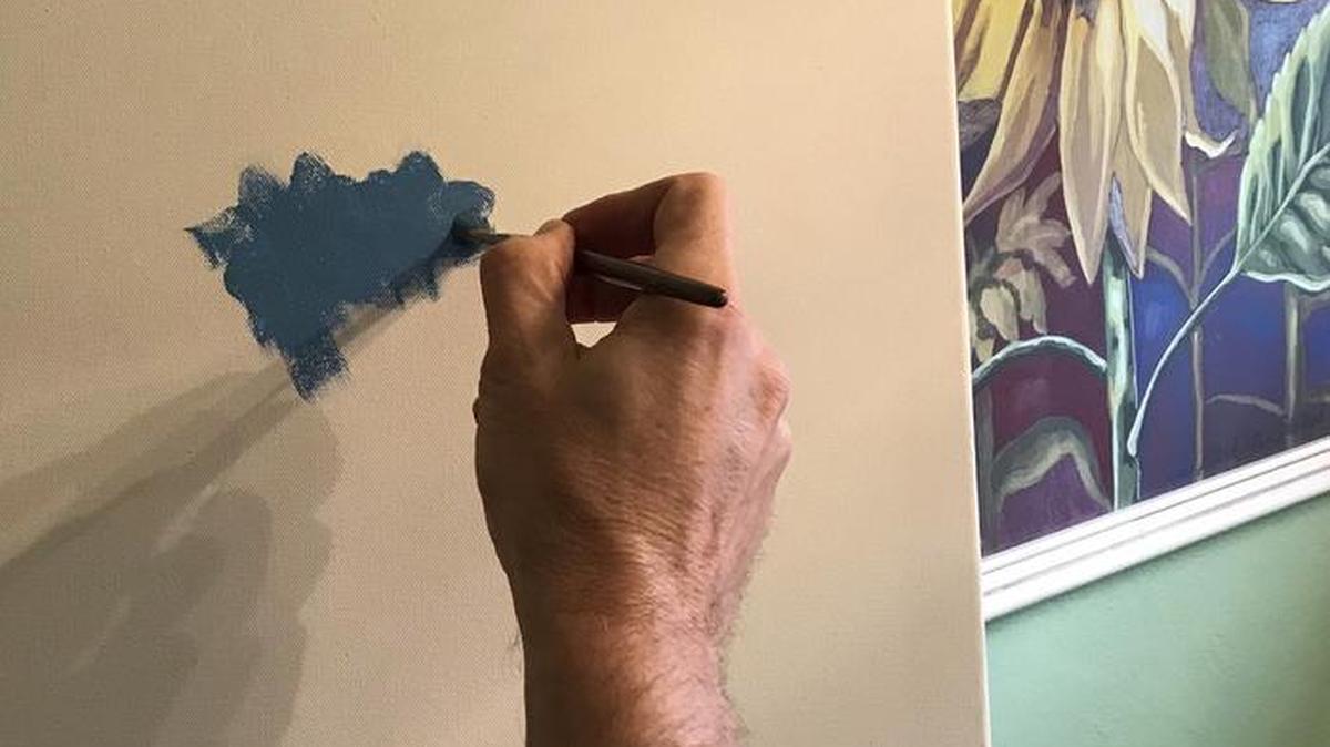 Mark Ballard gets started on a fresh canvas.