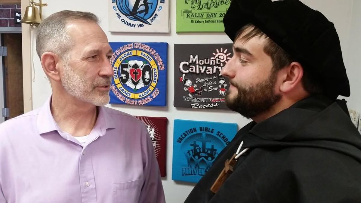 The Rev. David Brighton of Mount Calvary Lutheran Church talks with Vicar Brad Welik about his role as Martin Luther.