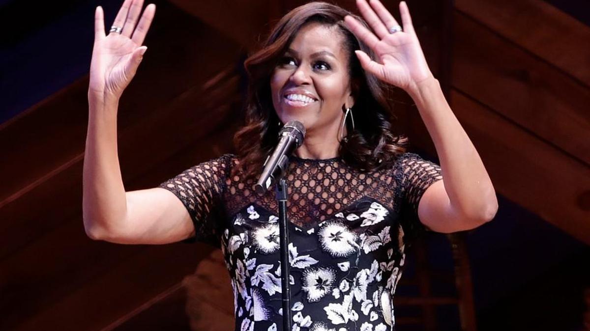 First lady Michelle Obama reacts to applause Monday as she hosts “Broadway Shines A Light on Girls’ Education” show at the Bernard B. Jacobs Theatre in New York.