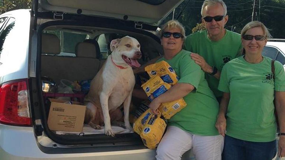 AC Pup and Central Georgia CARES members Tracie VanDeWalker, Jeff Battcher and Janet Battcher prepare to deliever pet food to folks in need.