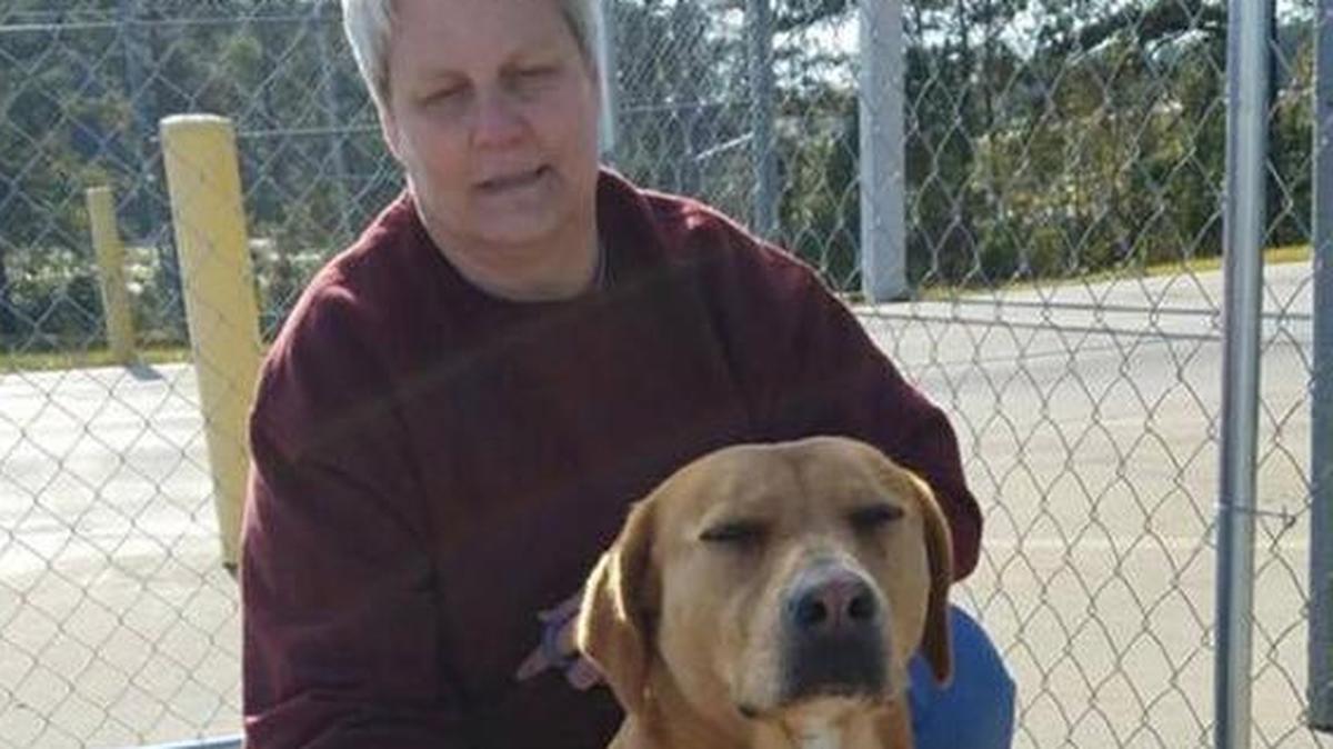 Janell Johnson poses for a photo with Cleo, who is finally off the streets and is now hoping for a home.