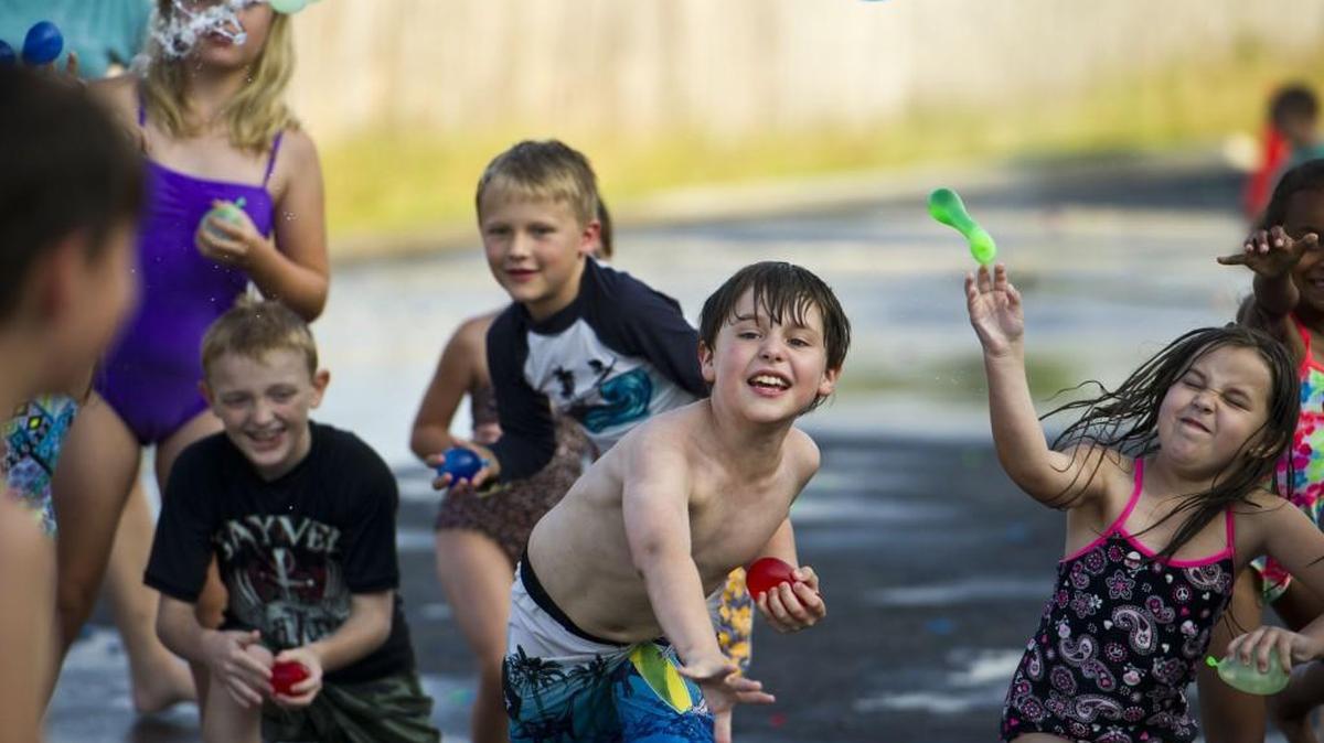Lucas Strout, 10, throws a water balloon during the Centerpoint Church Kids Life water battles at the church May 18.