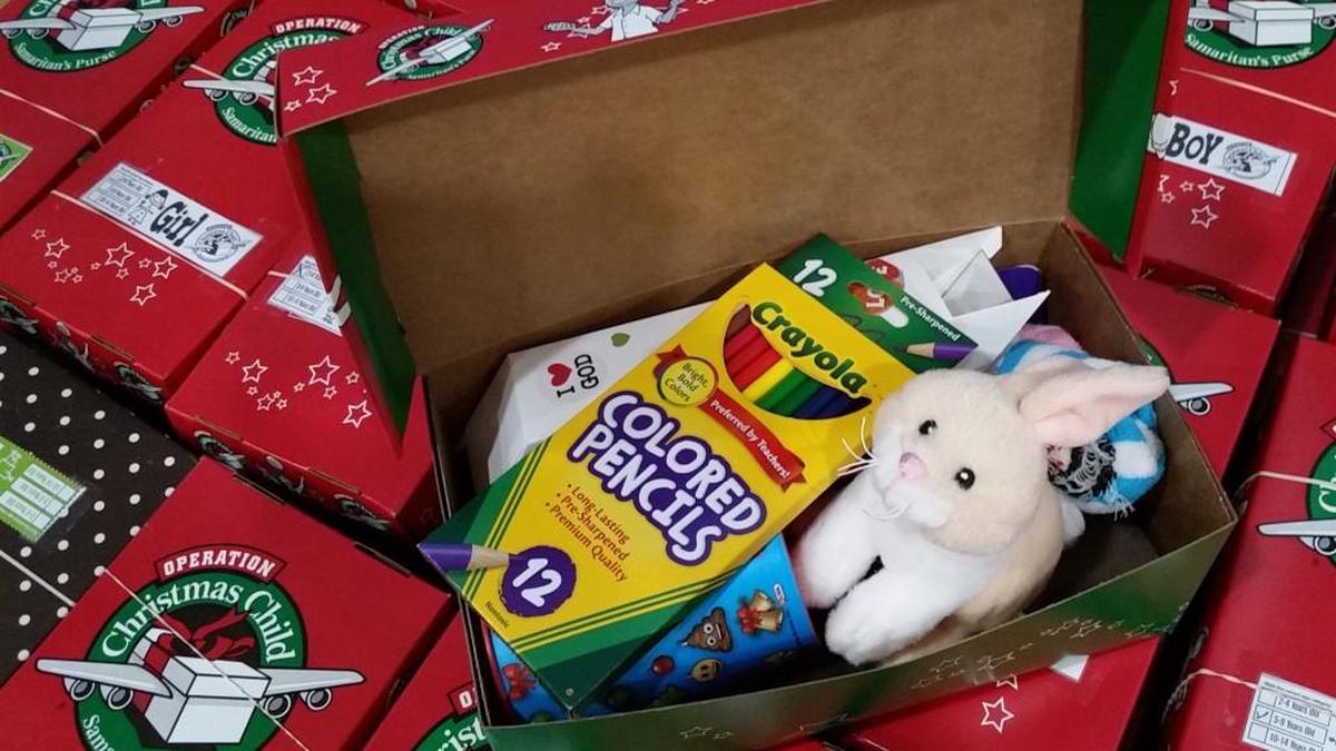 A box packed during a “packing party” at Pine Forest Baptist Church contains a variety of items, including school supplies and a “wow” gift: a small stuffed bunny.