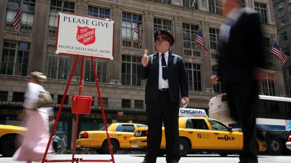 Salvation Army Soldier Daniel Aherns collects donations on 5th Ave. at Rockefeller Center.