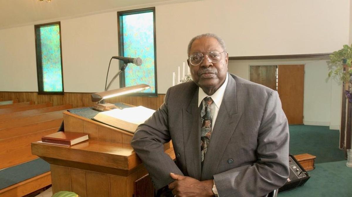In this 2002 file photo, Progressive Baptist Church pastor Curtis Tolbert is pictured in the sanctuary of the church he founded in the 1970s.