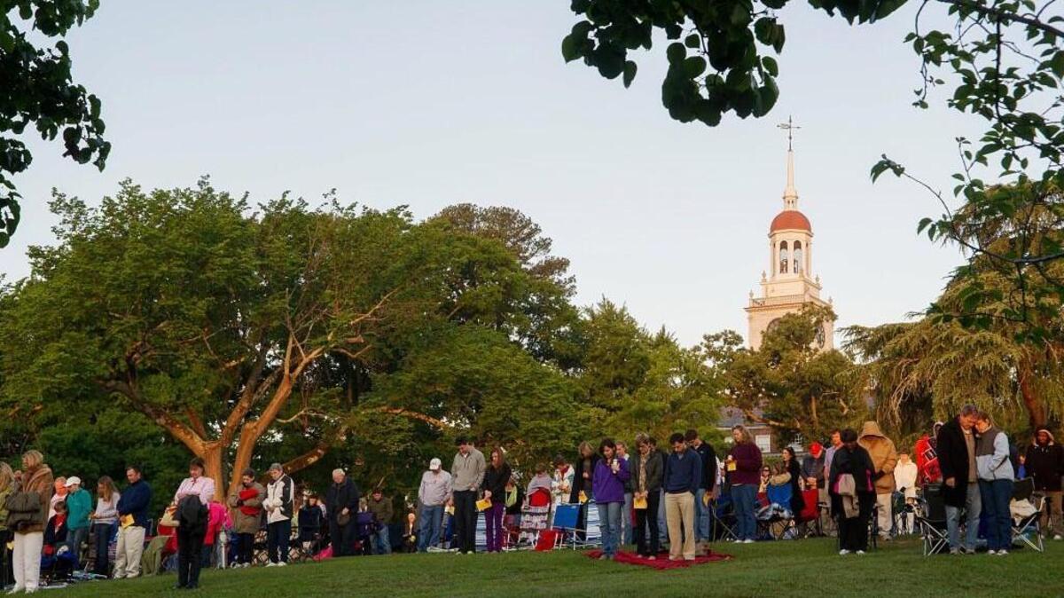 Worshipers close a previous Easter Sunrise Service on Coleman Hill in Macon with prayer. This year, the service begins at 7 a.m. Sunday.