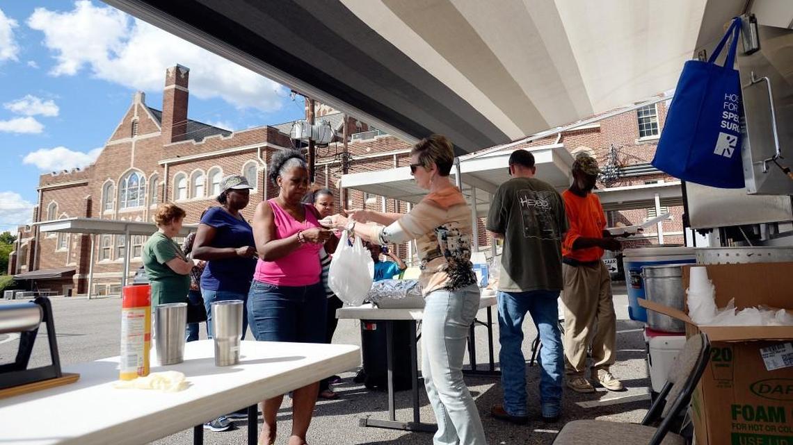 Chicken dinners are served outside Vineville Baptist Church during its fall bazaar Oct. 8, 2016.