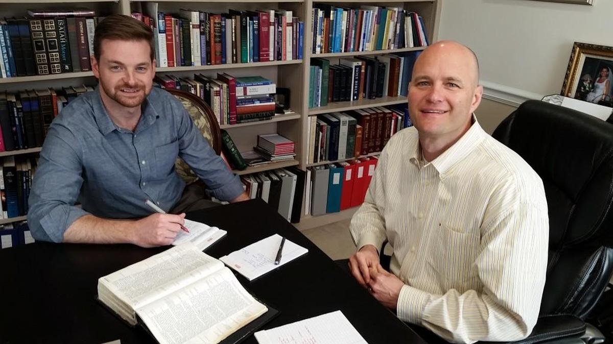 Associate pastor Josh Garrett, left, and senior pastor Hunter Stevenson review plan future ministries at North Macon Presbyterian Church.