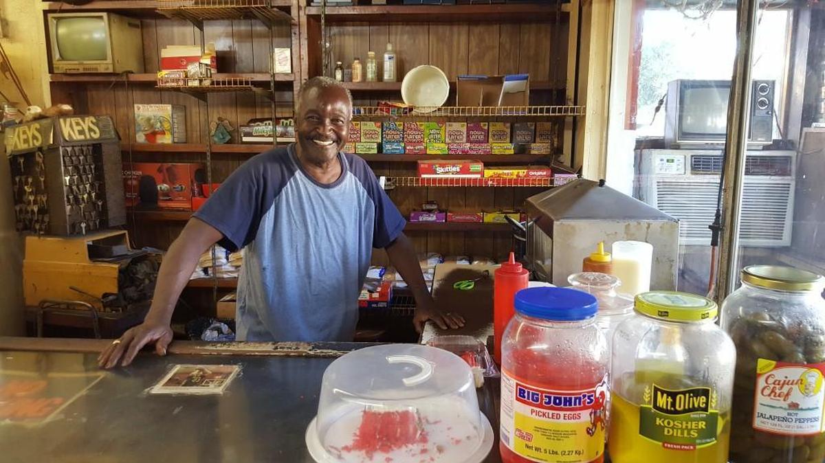 Willie Charles Belvin stands behind the counter of Anthony’s 1-Stop. From here he can make a key, extend a hearty welcome and serve customers a “chip dog.” A “chip dog” is a steamed hotdog in a bun, covered with chipped pieces of Boston butt in a sweet barbecue sauce.