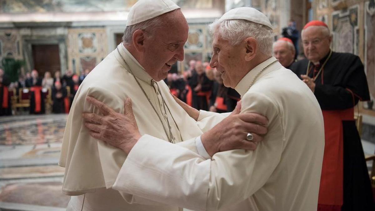Pope Francis, left, and retired Pope Benedict XVI embrace Tuesday during a ceremony at the Vatican to celebrate Benedict’s 65th anniversary of his ordination as a priest.