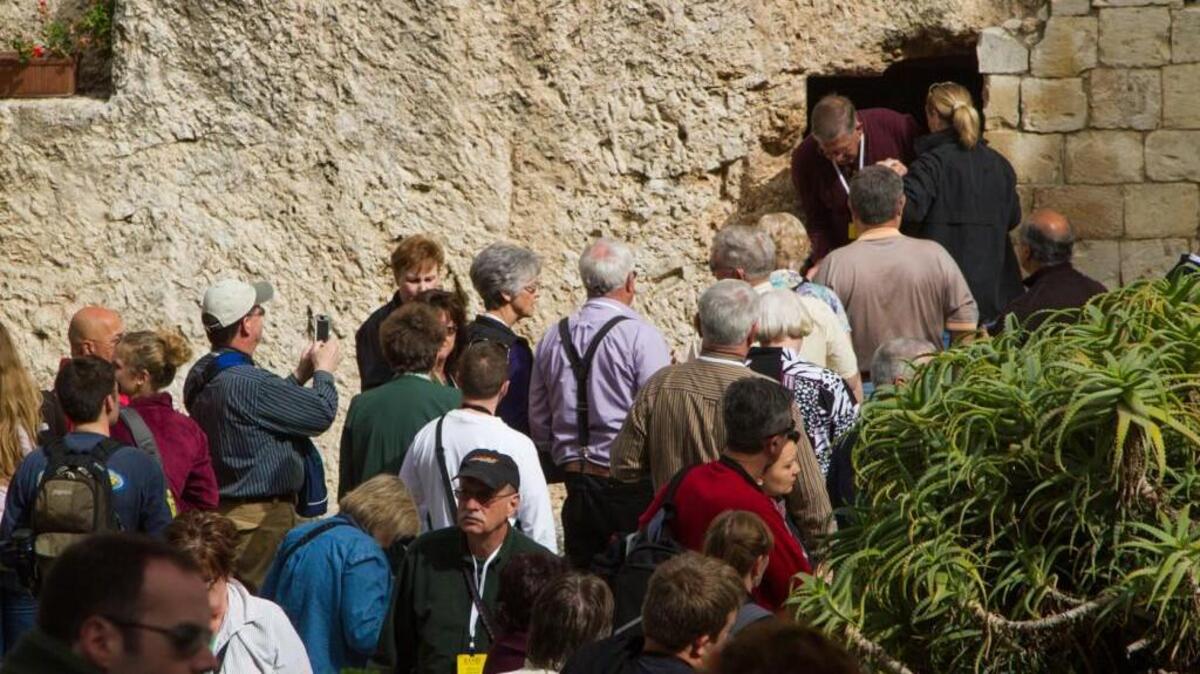 Tourists enter the Garden Tomb in Jerusalem. Columnist Andy Cook and his tour group will attend an Easter sunrise service there on Sunday morning.