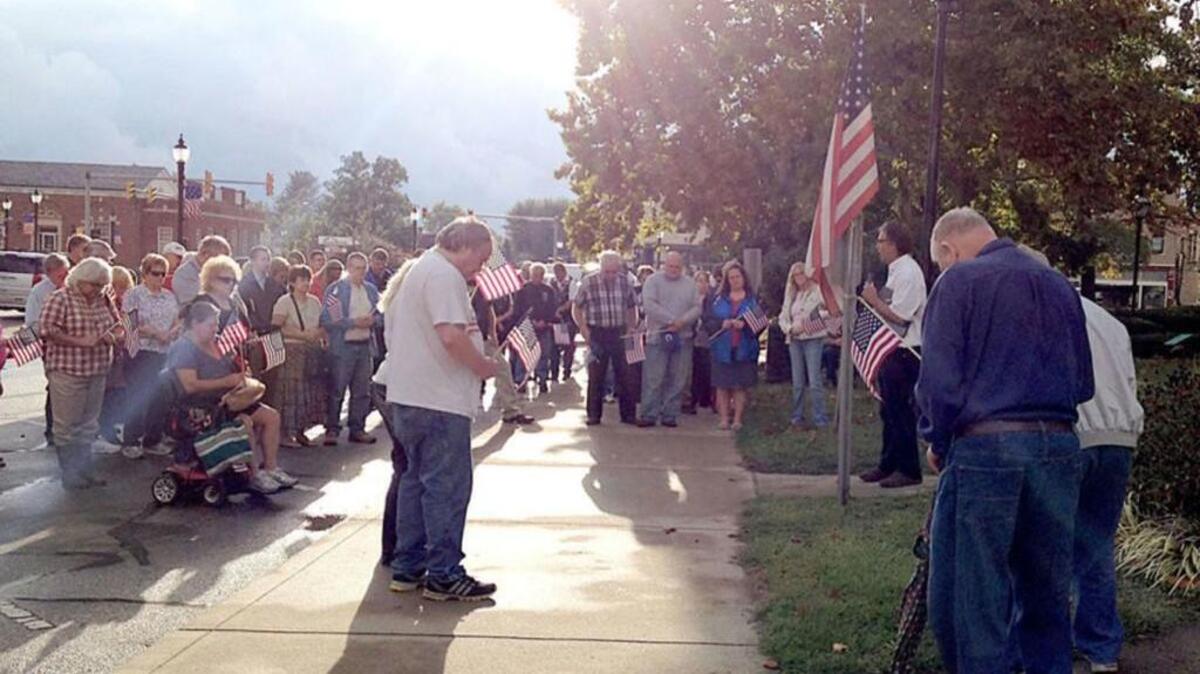 People gather to pray during a Cry Out America service in 2015.