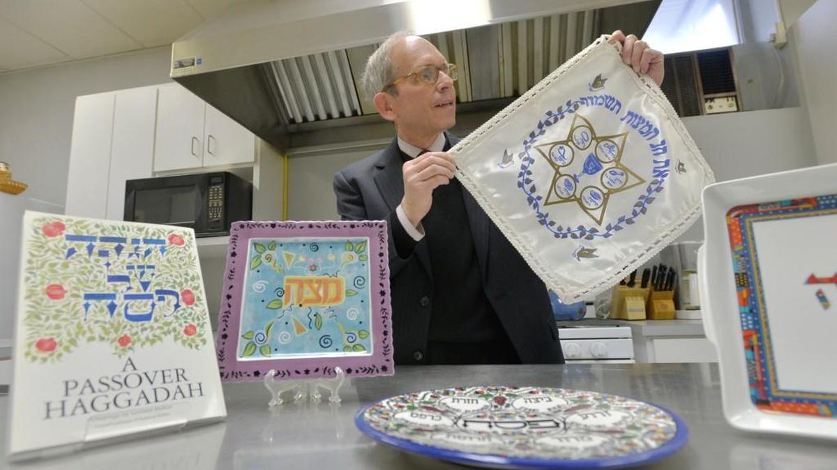In this 2015 file photo, Rabbi Larry Schlesinger holds a special matzo bag in the kitchen at Temple Beth Isreal where the congregation planned to serve up a special Passover feast.