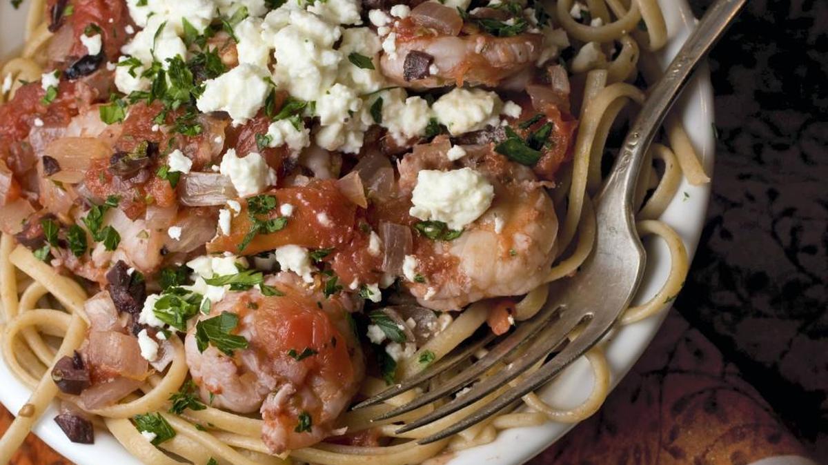 Whole-grain pasta with shrimp, tomatoes and feta cheese.
