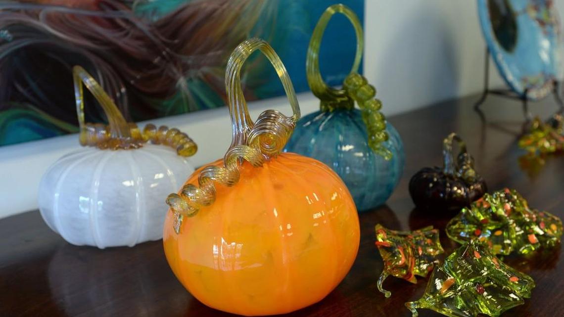 Blown glass pumpkins and fall leaves are available at newly opened Chrysanthemum Gallery on Forsyth Road.