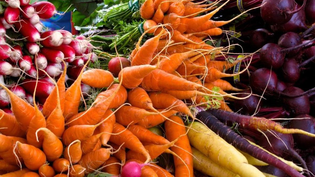 This photo taken on Oct. 5, 2013 shows radishes, carrots, turnips, and beets, at a farmer's market.