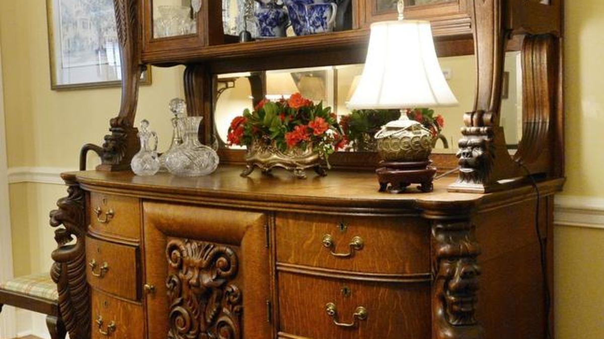 An English oak server is a highlight in the dining room of Pat Smith’s home.