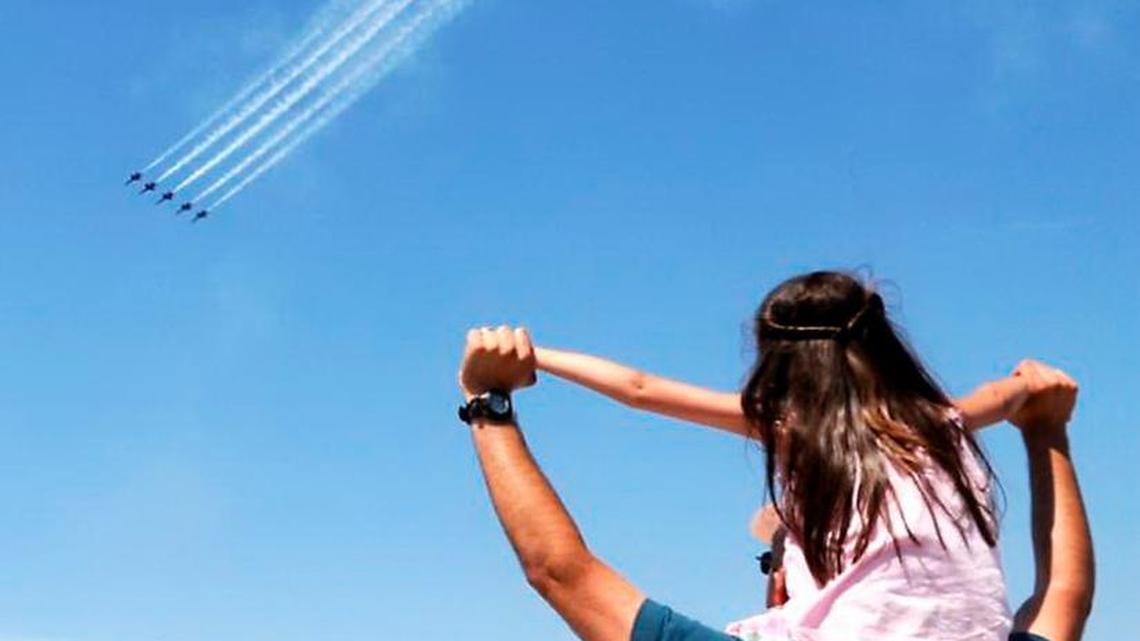The U.S. Navy Blue Angels fly over a record crowd during the 2012 Robins Air Show at Robins Air Force Base.