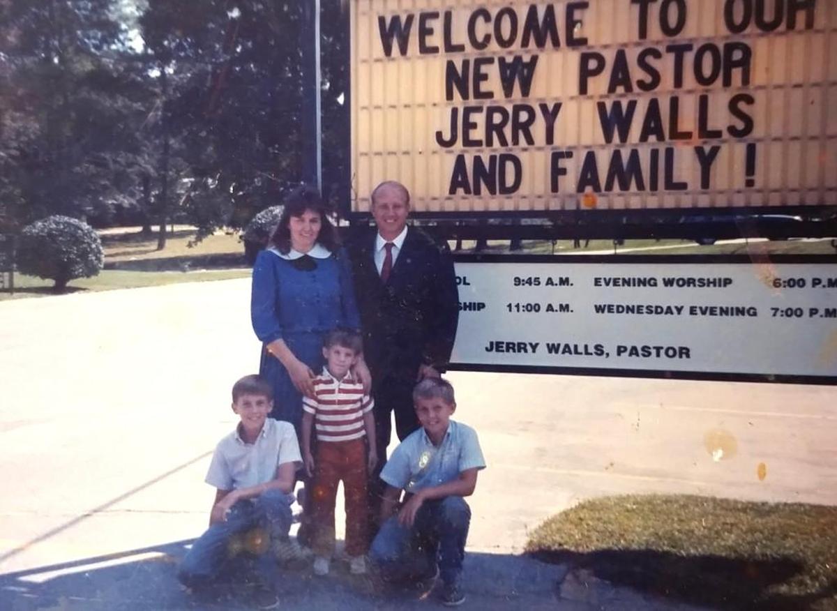 Copy of a photo of Jerry Walls and his family being welcomed to Southside Baptist Church in 1987.
