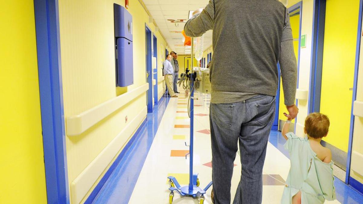 A father and his son, a patient at The Children’s Hospital, Navicent Health, are seen here in March 2014. The hospital is set for an upgraded facility within the next three years.