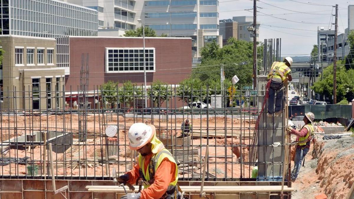 Workmen, making forms and tying steel reinforcement bars at the site of the Lofts at Navicent project in downtown Macon, are bringing the building out of the ground.