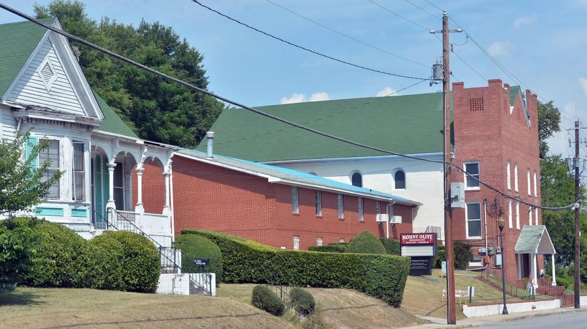 Mount Olive Missionary Baptist Church on Oglethorpe Street, at right, has doors that were rejected by the builders of the Hay House — but put to good use by the church.