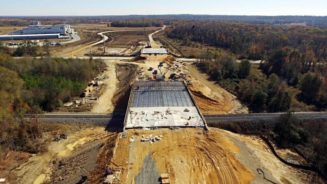 This aerial photo shows the Sardis Church Road extension eastbound over rail tracks and Houston Road in south Bibb near the Nichiha plant, left.