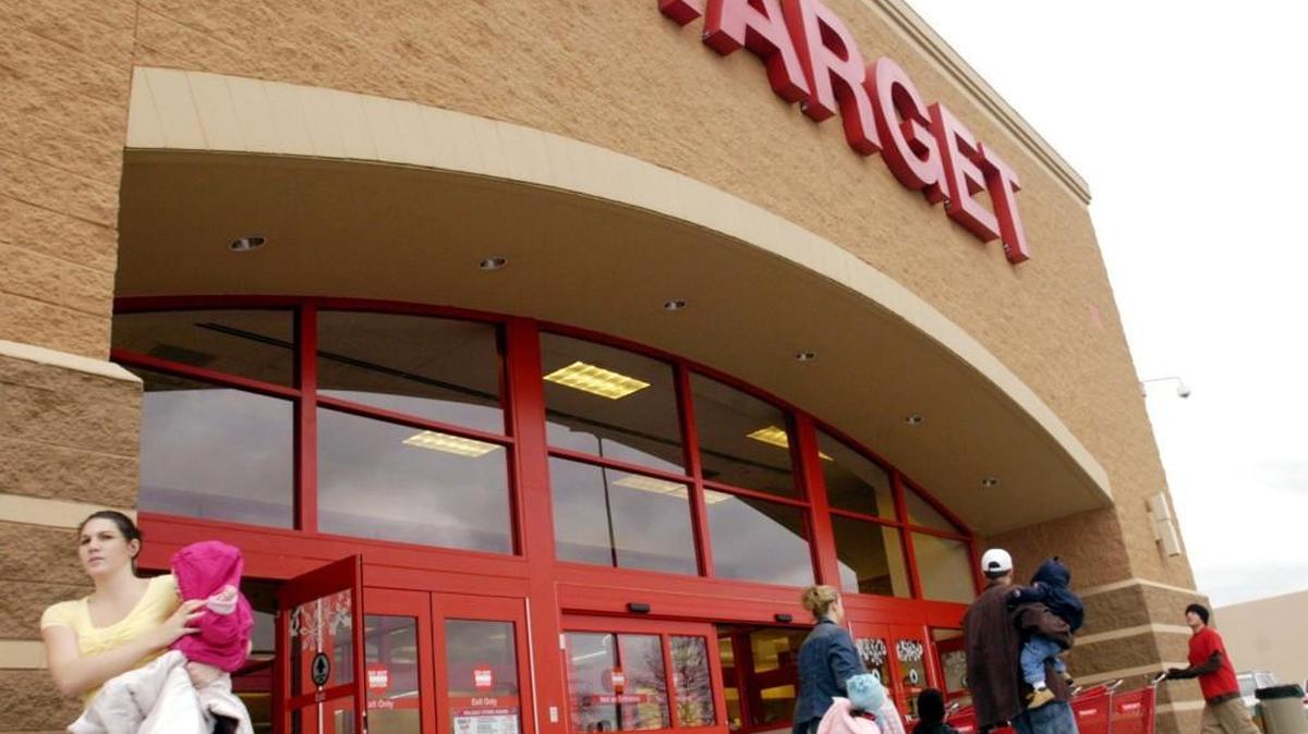 Shoppers walk out of Target on Dec. 26, 2006.