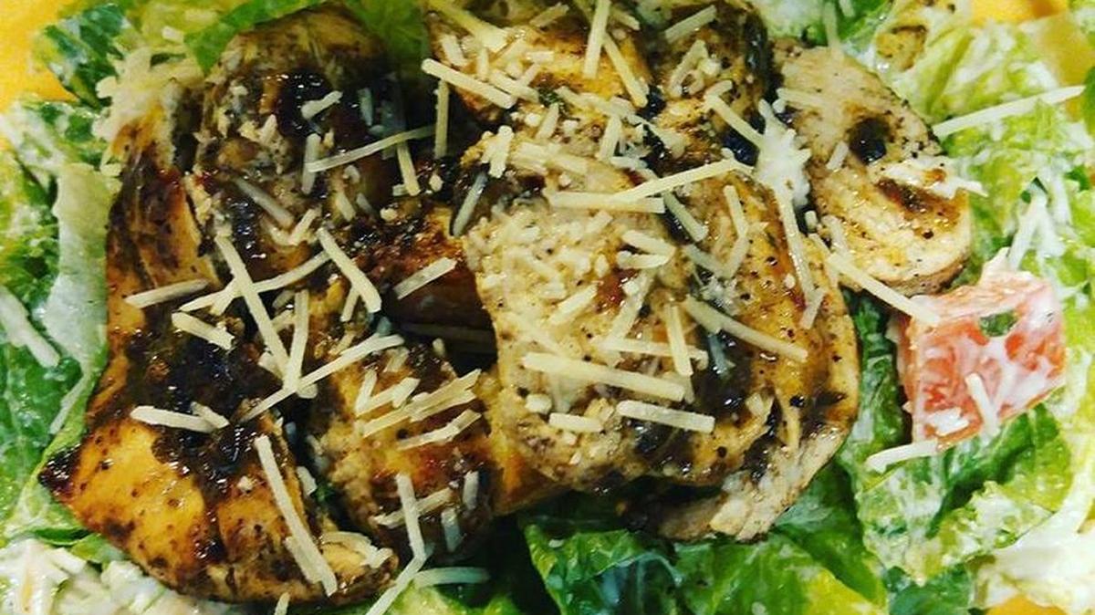 Jerk Caesar Salad is one of the Jamaican dishes made at Kirk’s Jerk Kitchen at 128 North Wayne St. in Milledgeville, Ga.