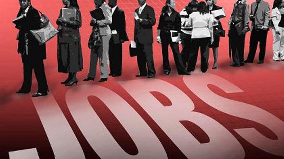 In this Aug. 24, 2010 photo, job seekers wait on line at a career fair in Newark, N.J. The U.S. economy grew unevenly in early fall, with more than half the regions of the country expanding modestly while others are struggling to grow.