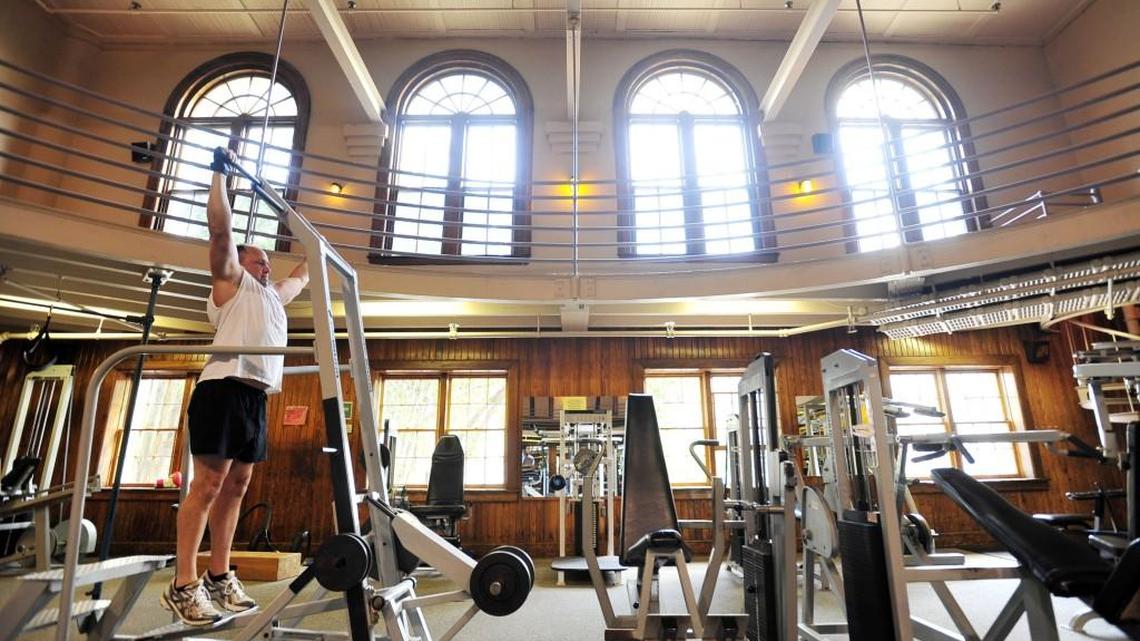 Andrew Foster uses weight training machines July 21, 2010, at the Macon Health Club downtown.