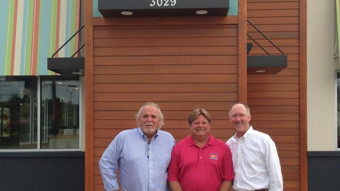 Mike Chumbley, left, and Allen Peake, right, co-own C&P Seafood Co., a 12-unit Captain D’s franchise in Middle Georgia. Greg Russ, middle, is a partner in that business. They sold the 12 stores in October, 2016. This image is from July 2014 at the Captain D's on Washington Road in Augusta.