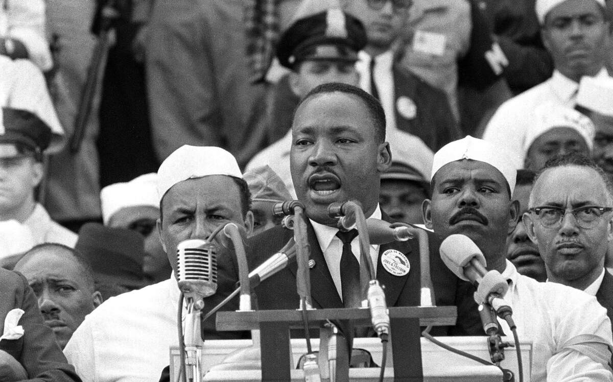 In this Aug. 28, 1963 photo, The Rev. Dr. Martin Luther King Jr., head of the Southern Christian Leadership Conference, gestures during his "I Have a Dream" speech as he addresses thousands of civil rights supporters gathered in Washington, D.C. Months before the Rev. Martin Luther King Jr. delivered his famous “I Have a Dream” speech to hundreds of thousands of people gathered in Washington in 1963, he fine-tuned his civil rights message before a much smaller audience in North Carolina. Reporters had covered King’s 55-minute speech at a high school gymnasium in Rocky Mount on Nov. 27, 1962, but a recording wasn’t known to exist until English professor Jason Miller found an aging reel-to-reel tape in the town’s public library. 