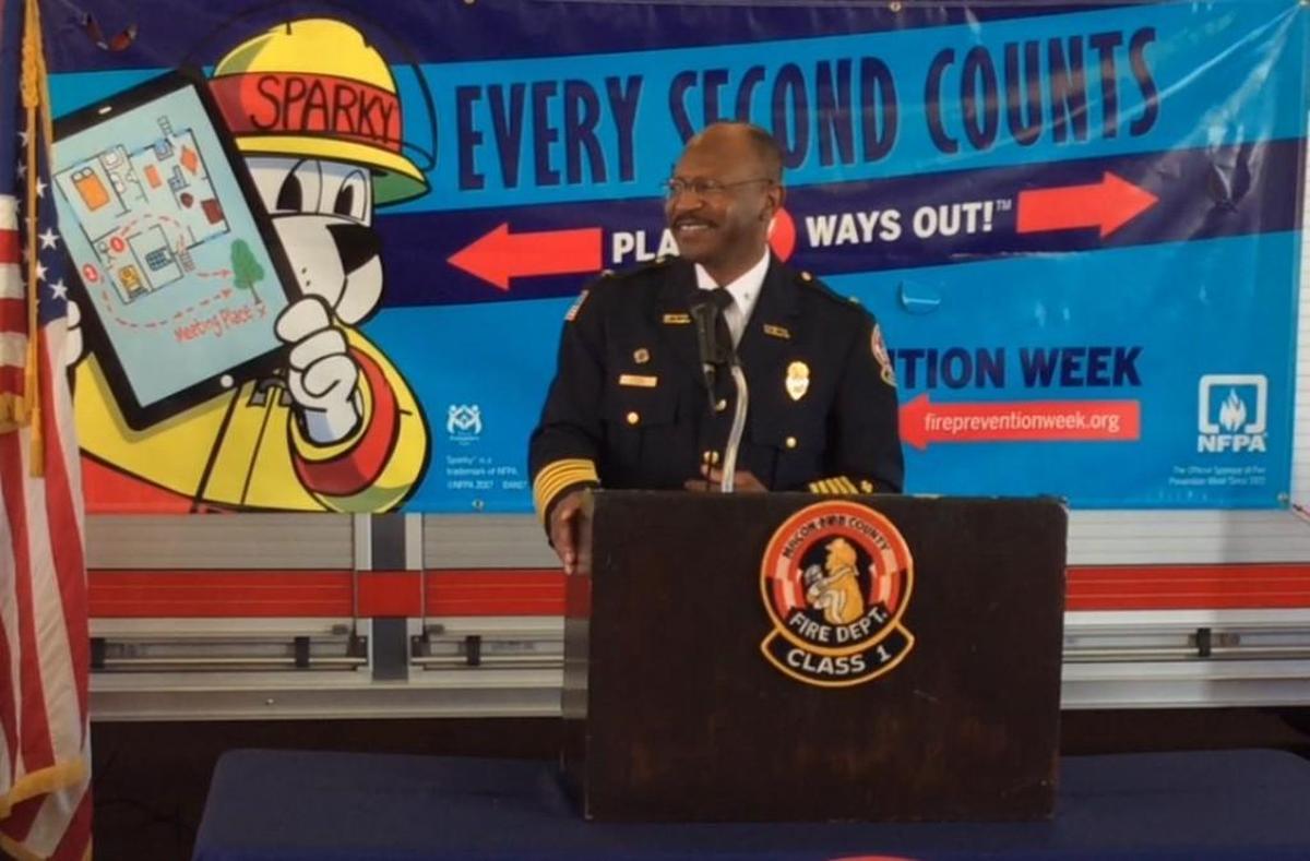 Macon-Bibb County Fire Chief Marvin Riggins pauses for a fire alarm during Wednesday's Fire Prevention Week kickoff at headquarters. “They got out in less than 45 seconds. That’s what we like to see,” he said of the firefighters’ quick departure.