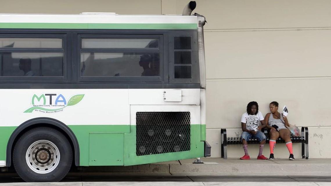 A Macon Transit Authority bus takes off from the Terminal Station where not everyone was taking advantage of the air-conditioned spaces Friday.