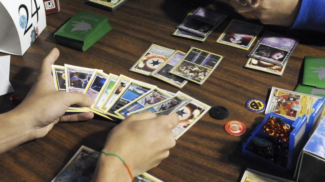 A Pokemon tournament is held in a comic book store.