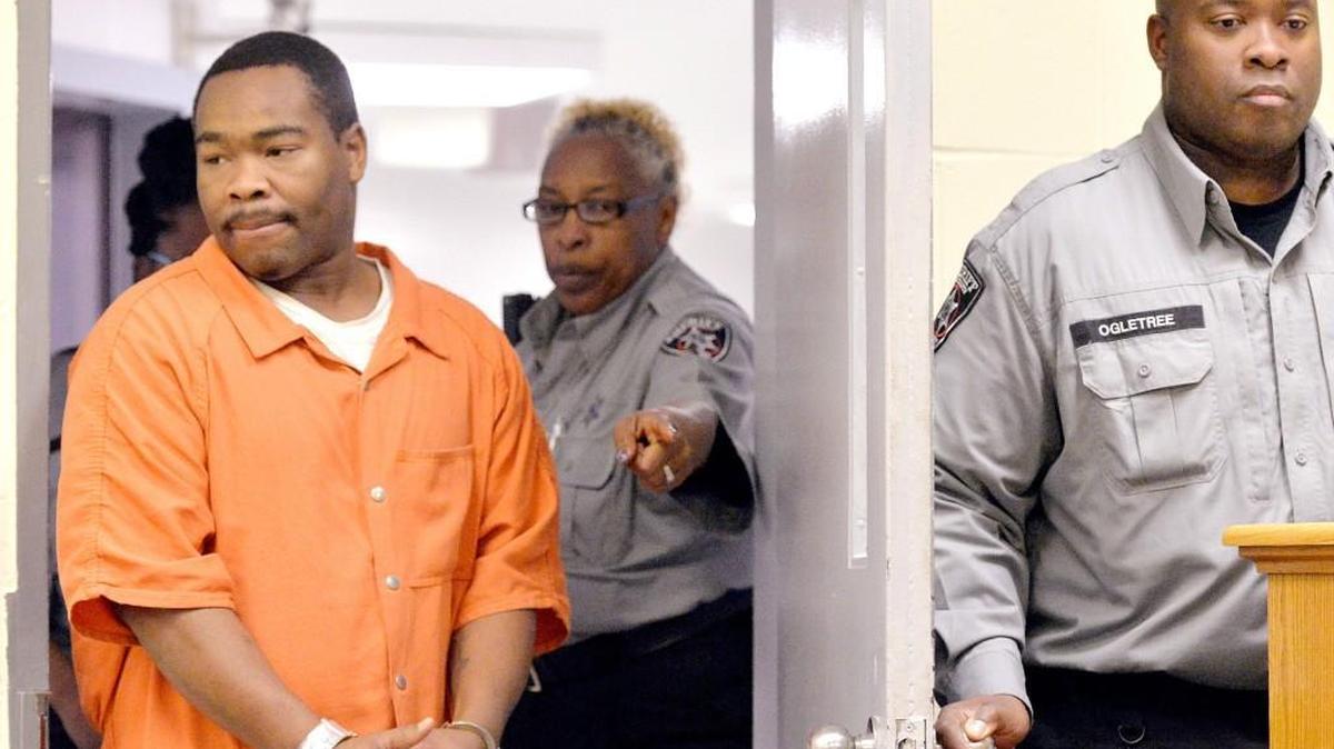 Damion Deray Henderson is lead into a Bibb County Magistrate Court hearing March 2, 2016.