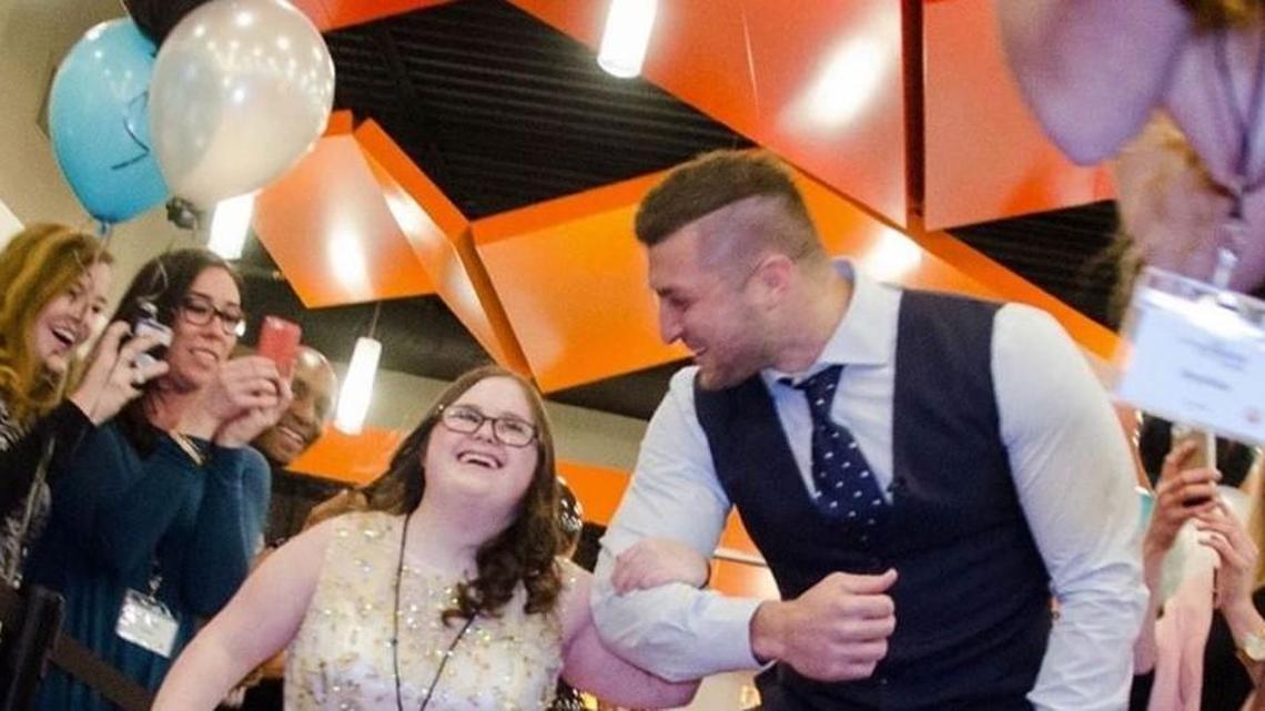 Tim Tebow ushers in a guest to one of the Tim Tebow Foundation Night to Shine events in this file photo posted on the foundation’s website. The annual event is being held Friday at nearly 400 locations in 50 states and 12 countries, including at Northridge Christian Church in Milledgeville.