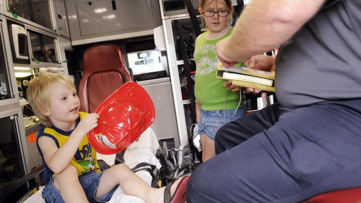Children will get a close look at emergency vehicles at Tuesday’s EMS for Children cookout at Northside Hospital. In this 2012 Telegraph file photo, Dominik Osterbuhr and Kerry Kirk hang out in the back of an ambulance.