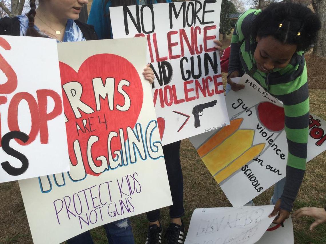 Midstate students show off their signs at Stratford Academy in Macon ahead of the March for Our Lives march and rally in Atlanta on Saturday. They joined between 25,000 and 30,000 marchers.