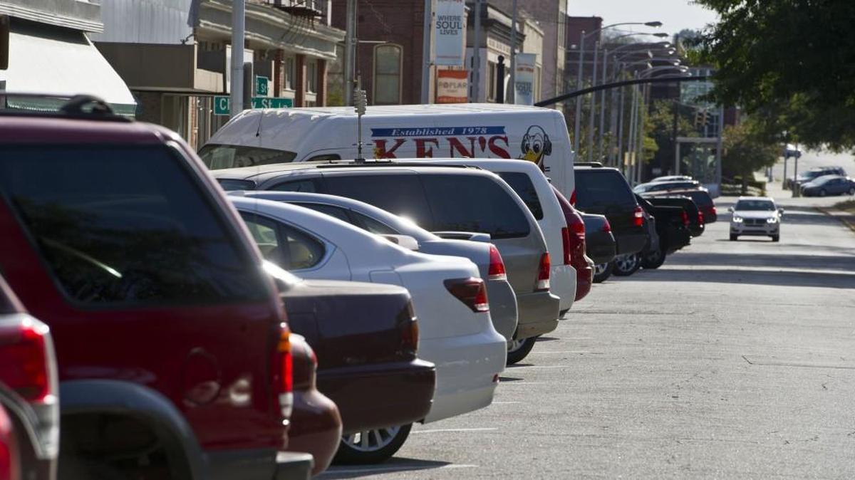 Vehicles are parked along Cherry Street between Third Street and Second Street on Monday afternoon.