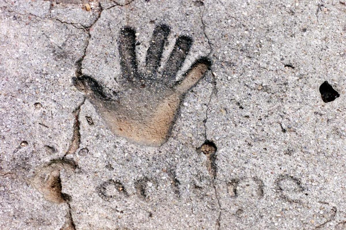 Carlene Tengelsen’s hand print at the end of the driveway on Easy Street in Macon, where her family lived in the 1970s.