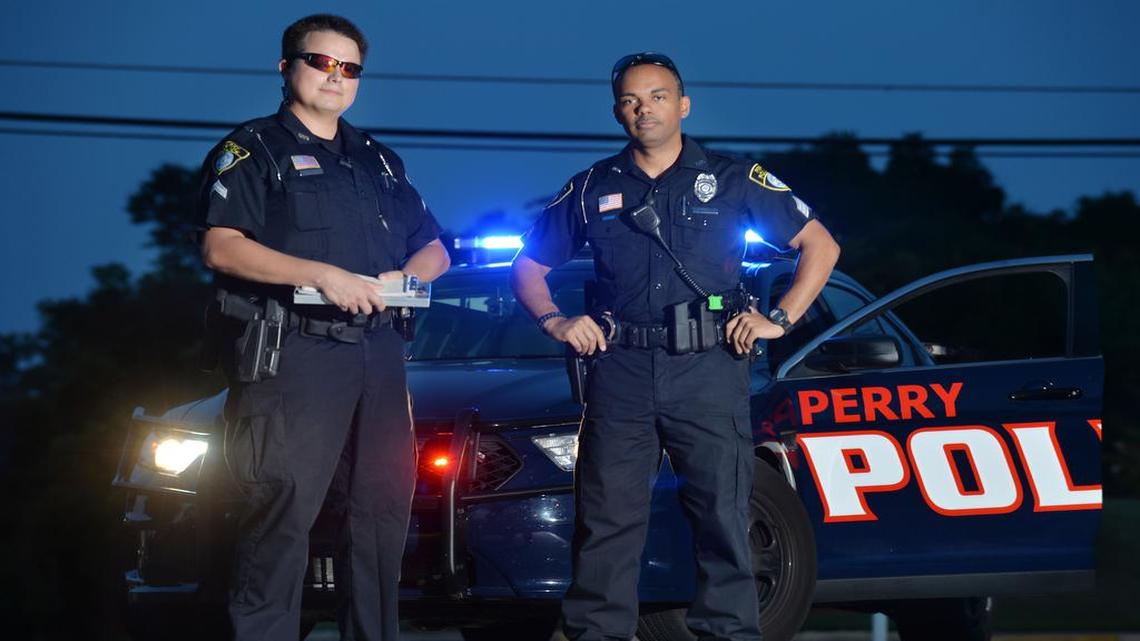 Perry Police officers Cpl. Armando Sanchez and Sgt. Jalon Heard model the department's new uniforms in this 2014 Telegraph file photo. Perry ranks #4 on Georgia’s safe cities list for 2017.